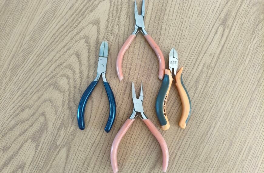 tools for making jewellery on on a wooden table. Jewellery making for beginners.