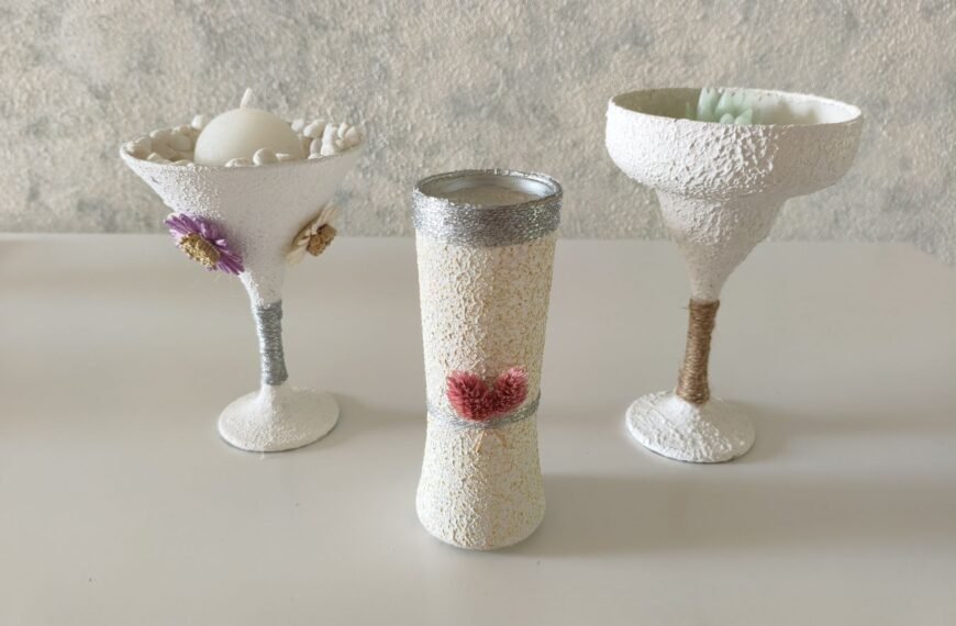 Three DIY glass vases with wall putty texture